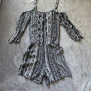 Worn once cold condition black and white romper.